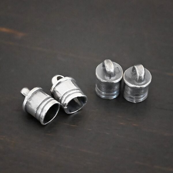 Silver Shiny & Oxidized 6x9mm end caps shown on dark background