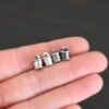 Silver shiny & oxidized 6x9mm end caps shown in hand