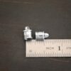 Silver shiny 6x9mm end caps shown by ruler