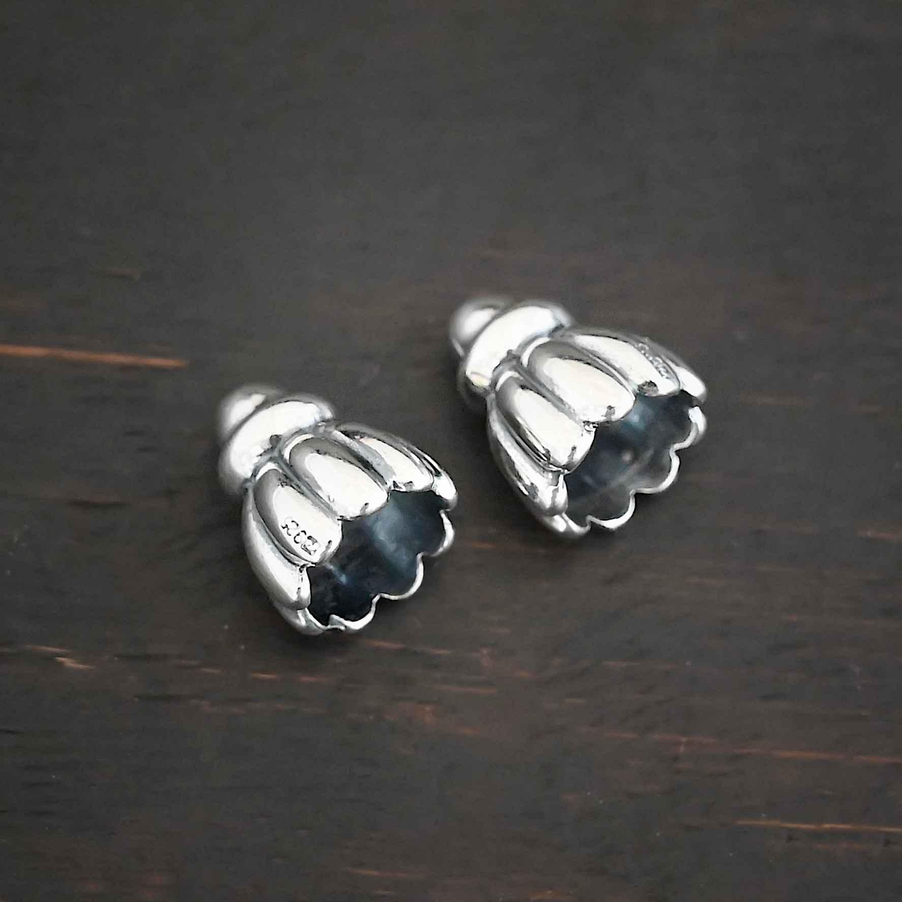 Silver Shiny Cone Flower Bead Caps shown on dark background