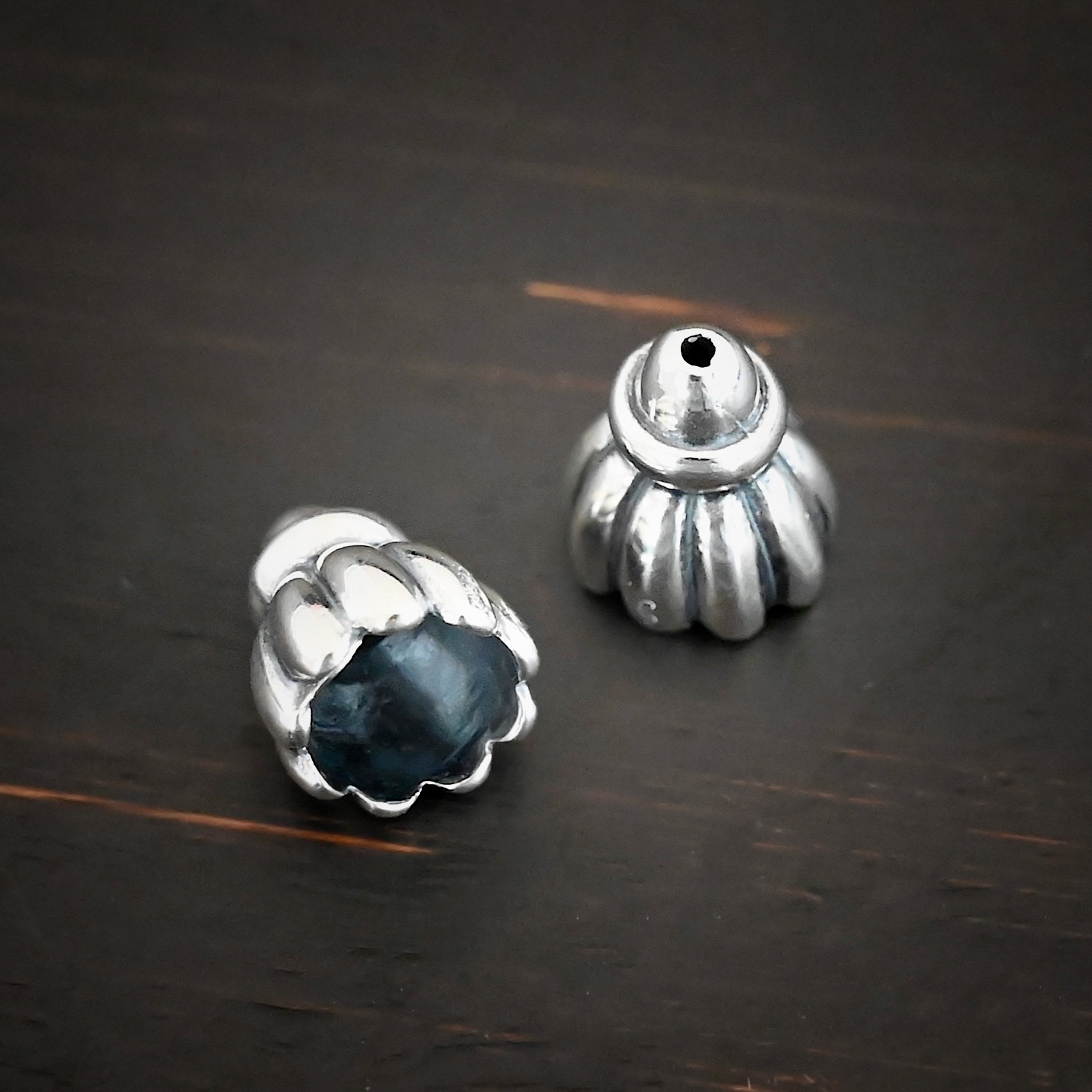 Silver Shiny Cone Flower Bead Caps shown on dark background