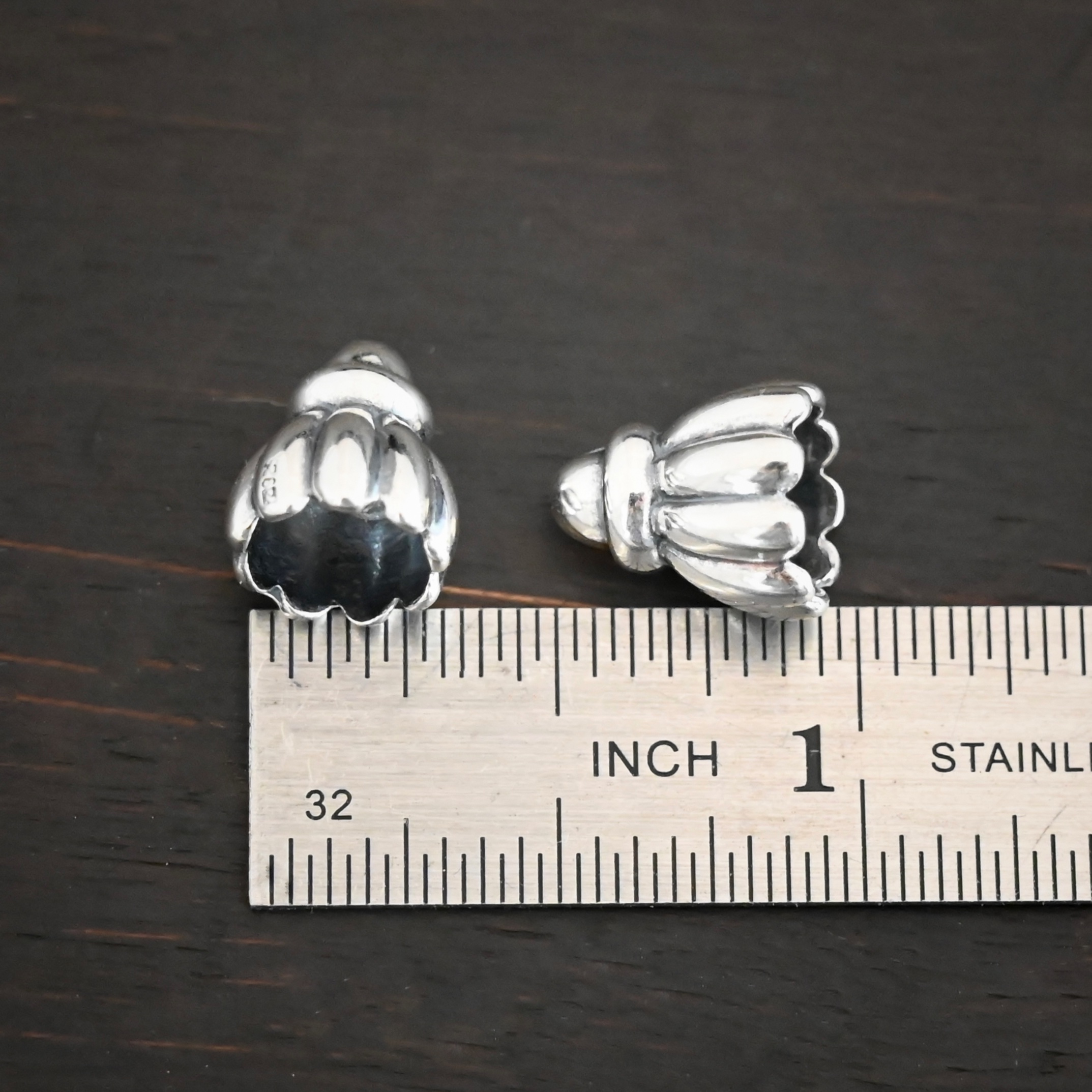 Silver Shiny Cone Flower Bead Caps shown by ruler