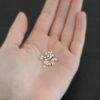 Silver shiny 3mm crimp covers shown in hand