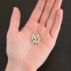 Silver shiny 4mm crimp covers shown in hand