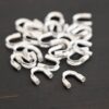 Silver shiny wire guards shown on dark background