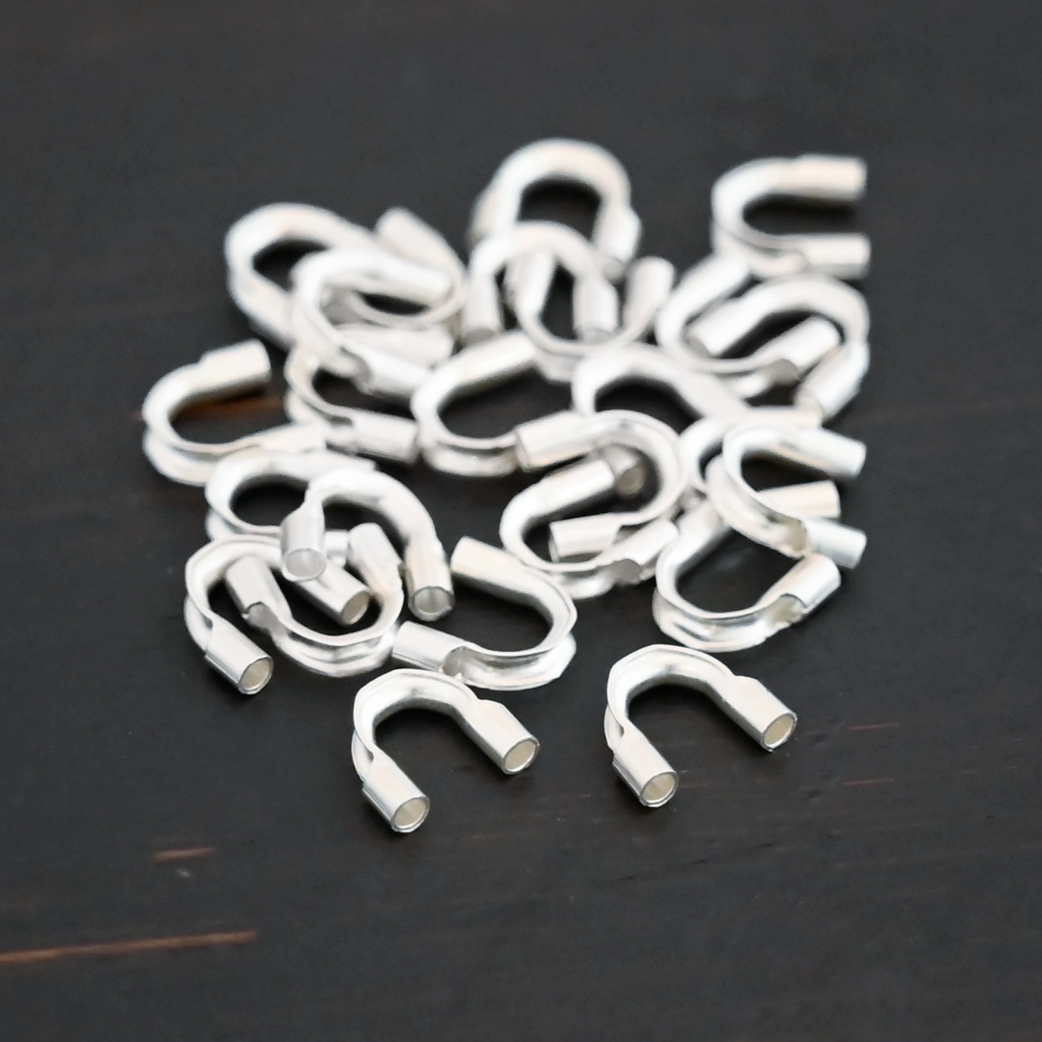 Wire Guards shiny Silver shiny wire guards shown on dark background