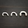 Silver shiny wire guards shown on dark background