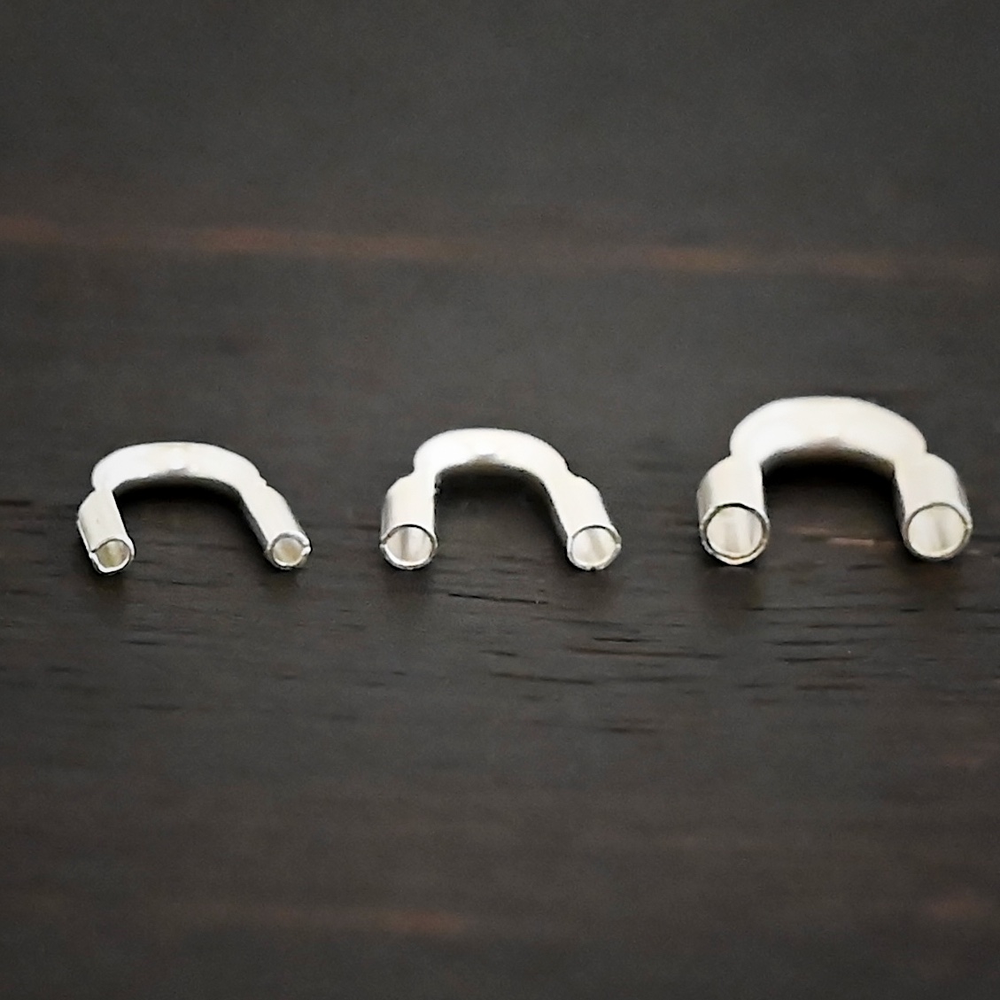 Wire Guards shiny Silver shiny wire guards shown on dark background