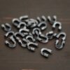 Silver oxidized wire guards shown on dark background