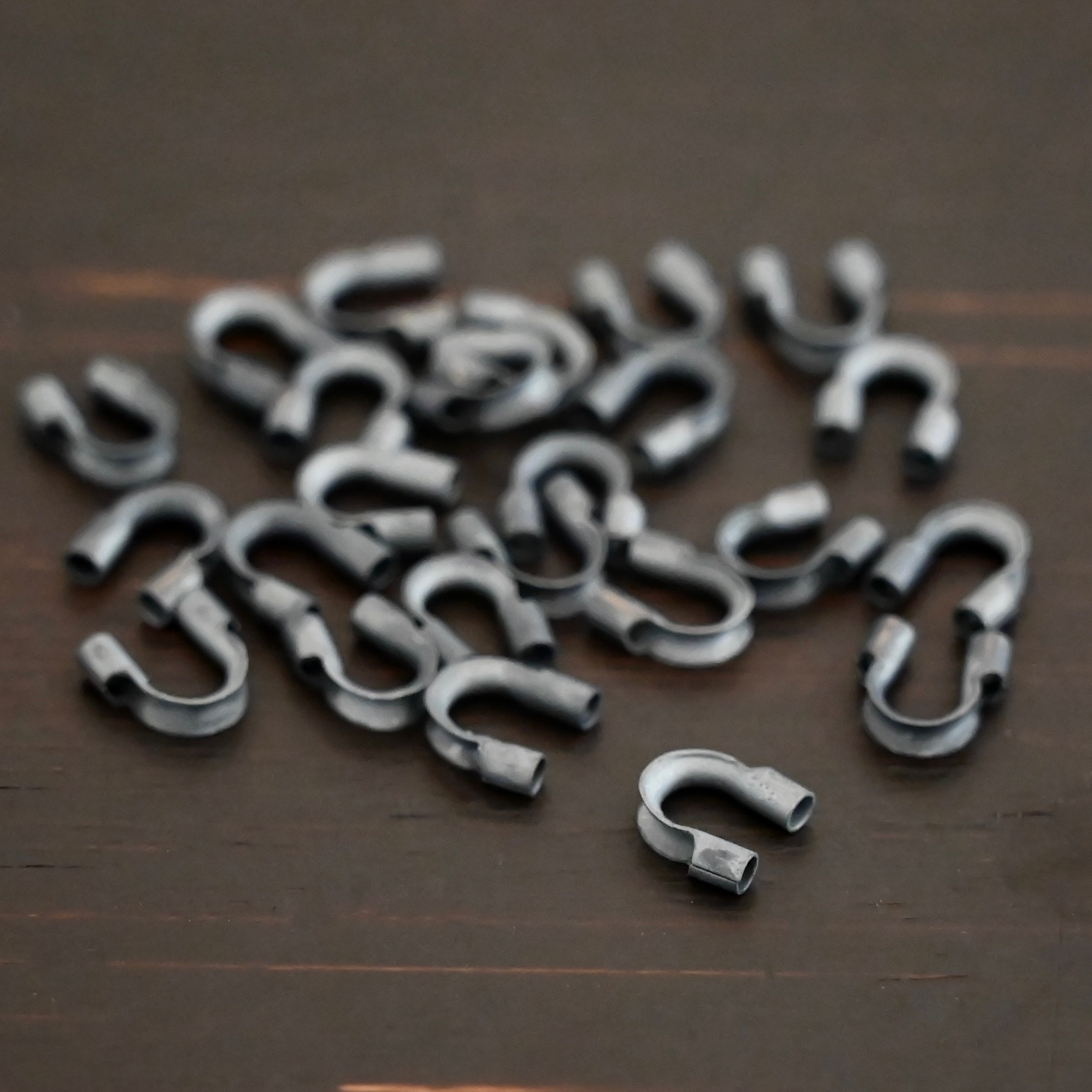 Wire Guards ox Silver oxidized wire guards shown on dark background