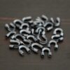 Silver oxidized wire guards shown on dark background