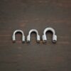 Silver oxidized wire guards shown on dark background