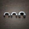 Silver oxidized wire guards shown on dark background