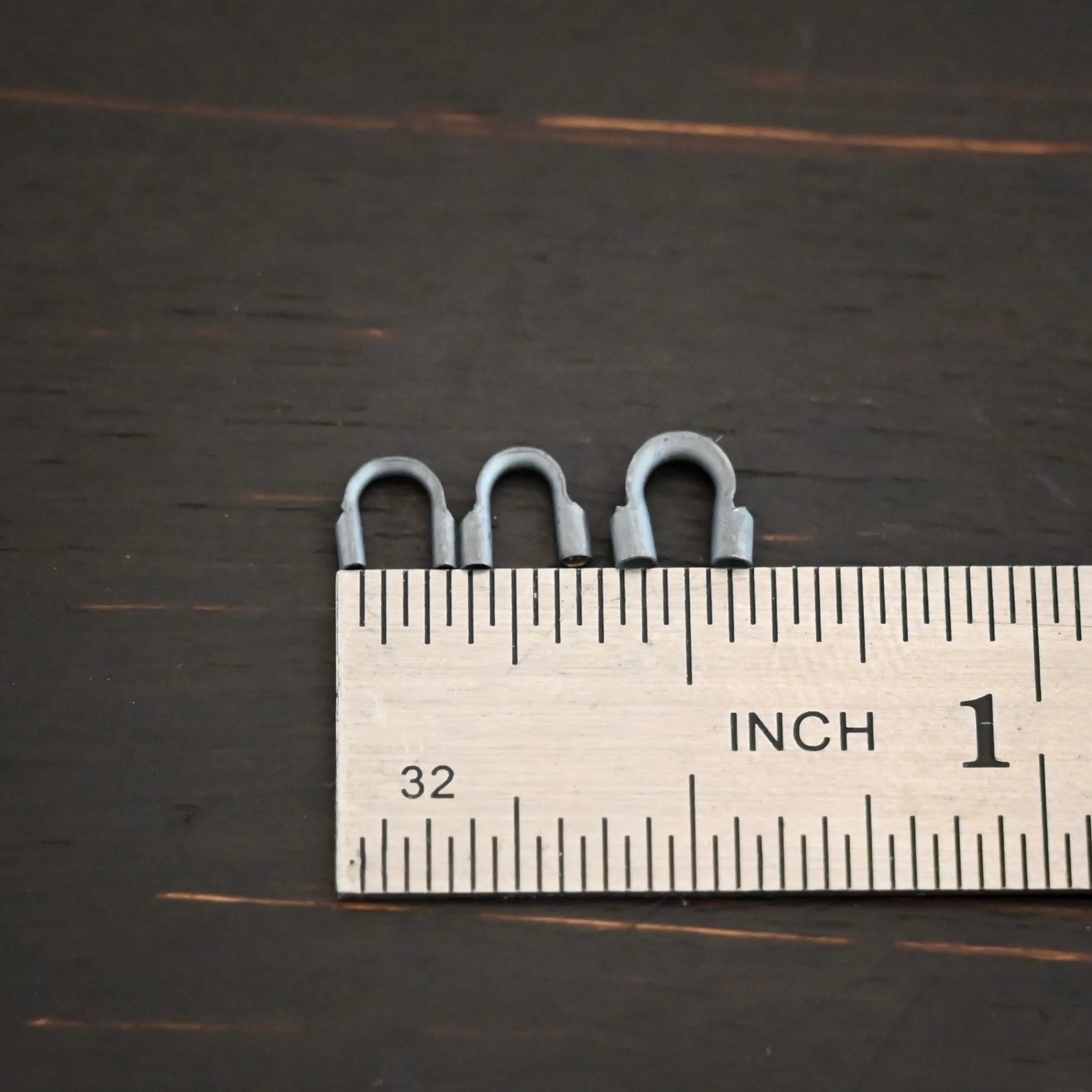 Wire Guards ox Silver oxidized wire guards shown by ruler
