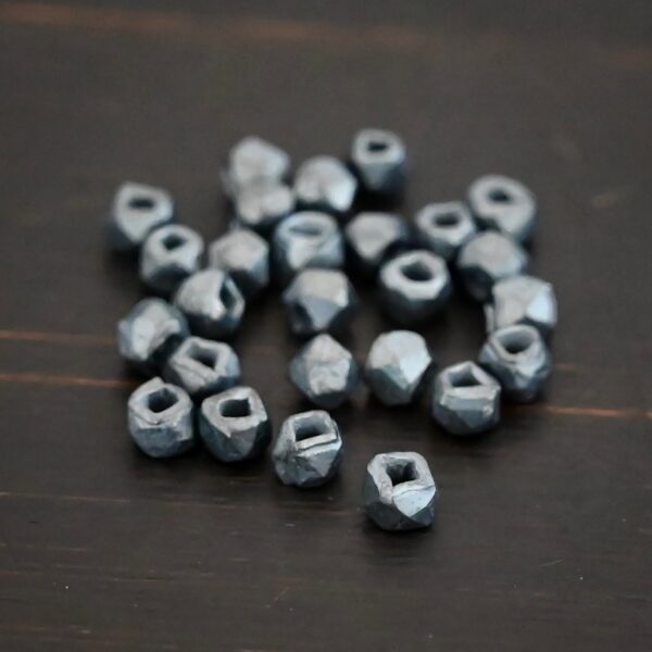 Silver oxidized cubed beads shown on dark background