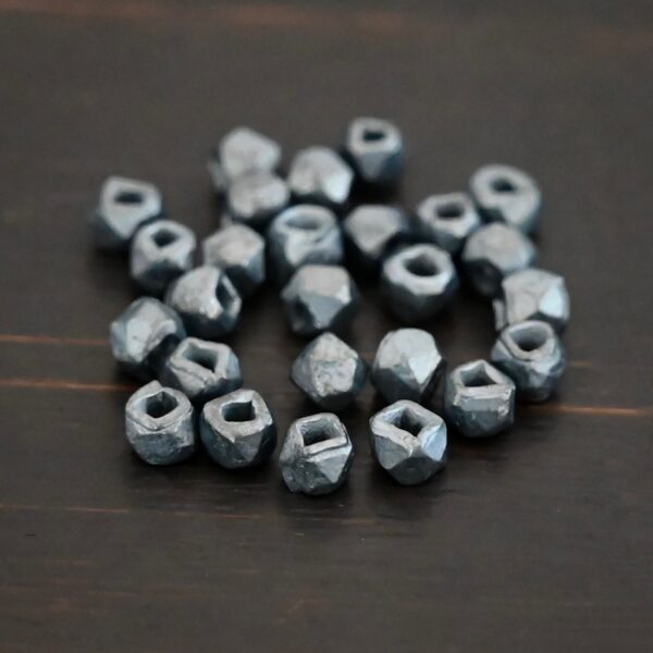 Silver oxidized cubed beads shown on dark background