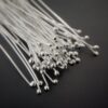 Small Shiny Silver Ball Headpins shown on dark background