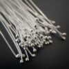 Small Shiny Silver Ball Headpins shown on dark background