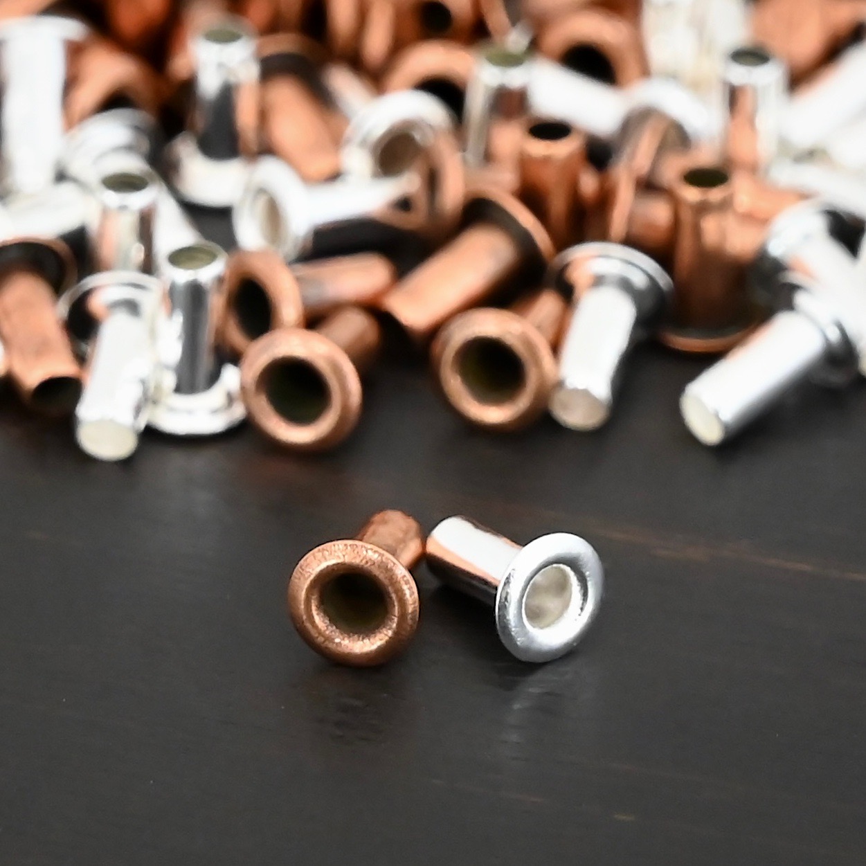 3/32x1/5 plated eyelets shown on dark background