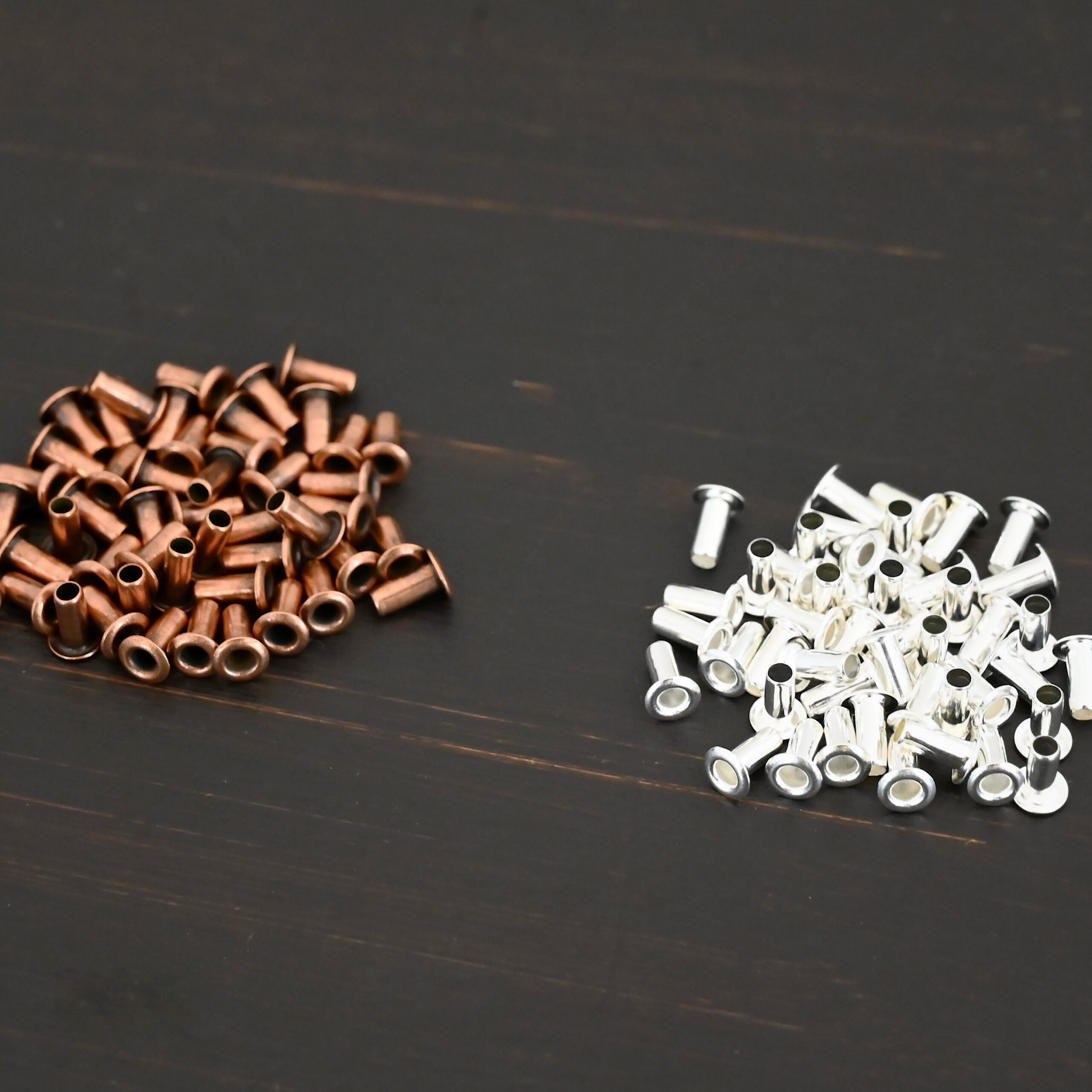 3/32x1/5 plated eyelets shown on dark background