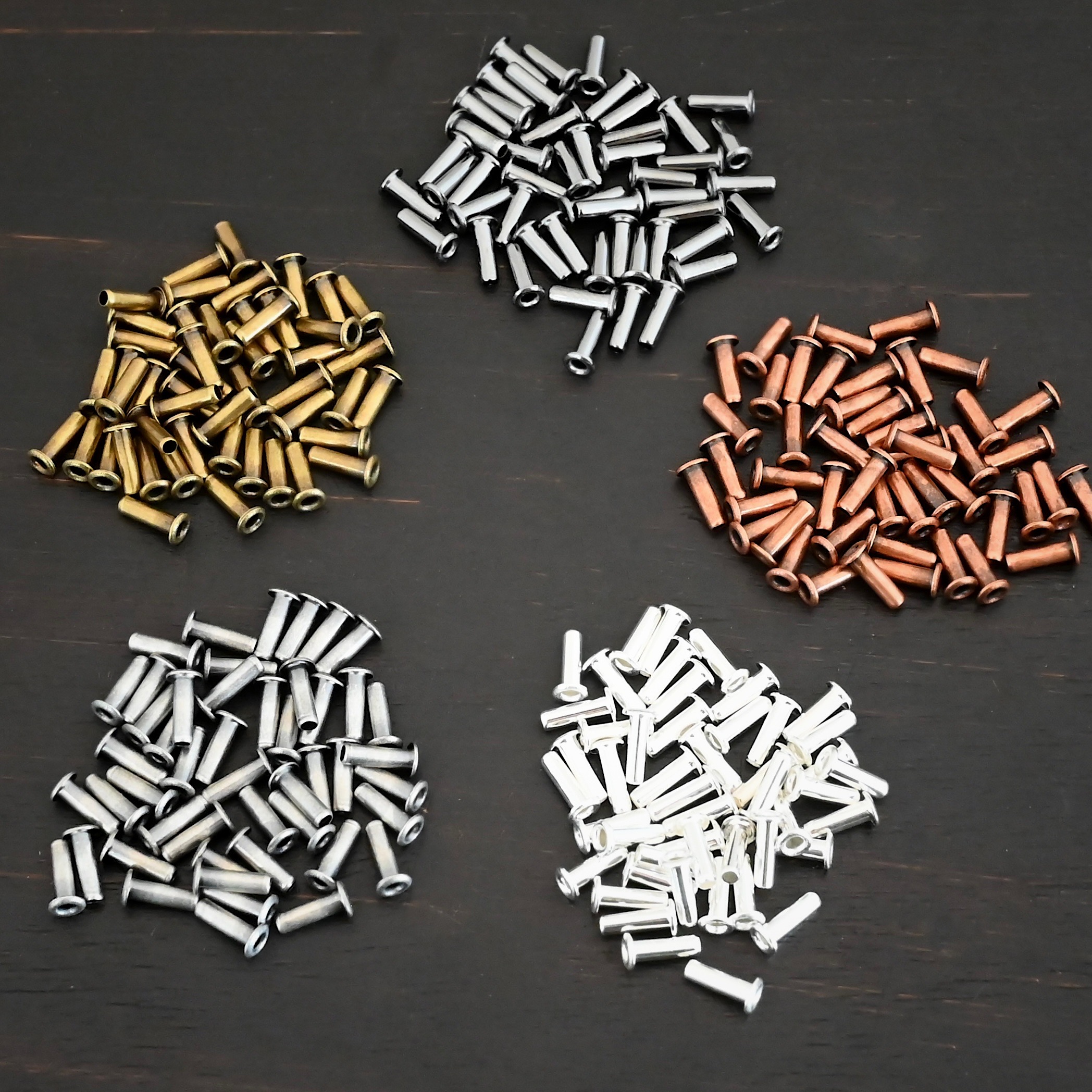 3/32x1/4 Plated Eyelets eyelets shown on dark background