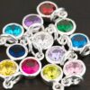 Silver Shiny 6mm Birthstone Charms shown on dark background