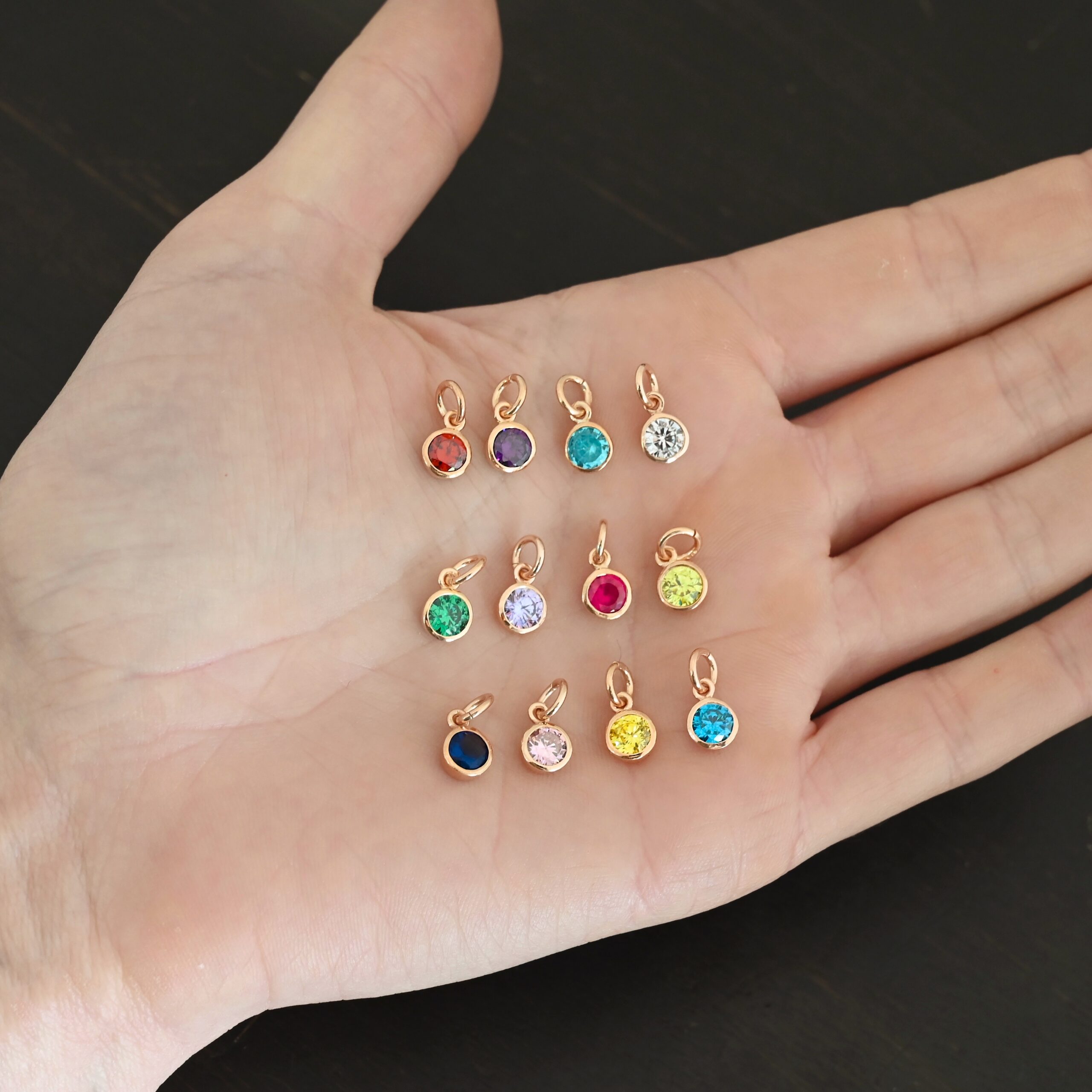 Rose Gold Plated 6mm Birthstone Rose Gold Plated 6mm Birthstone Charms shown in hand