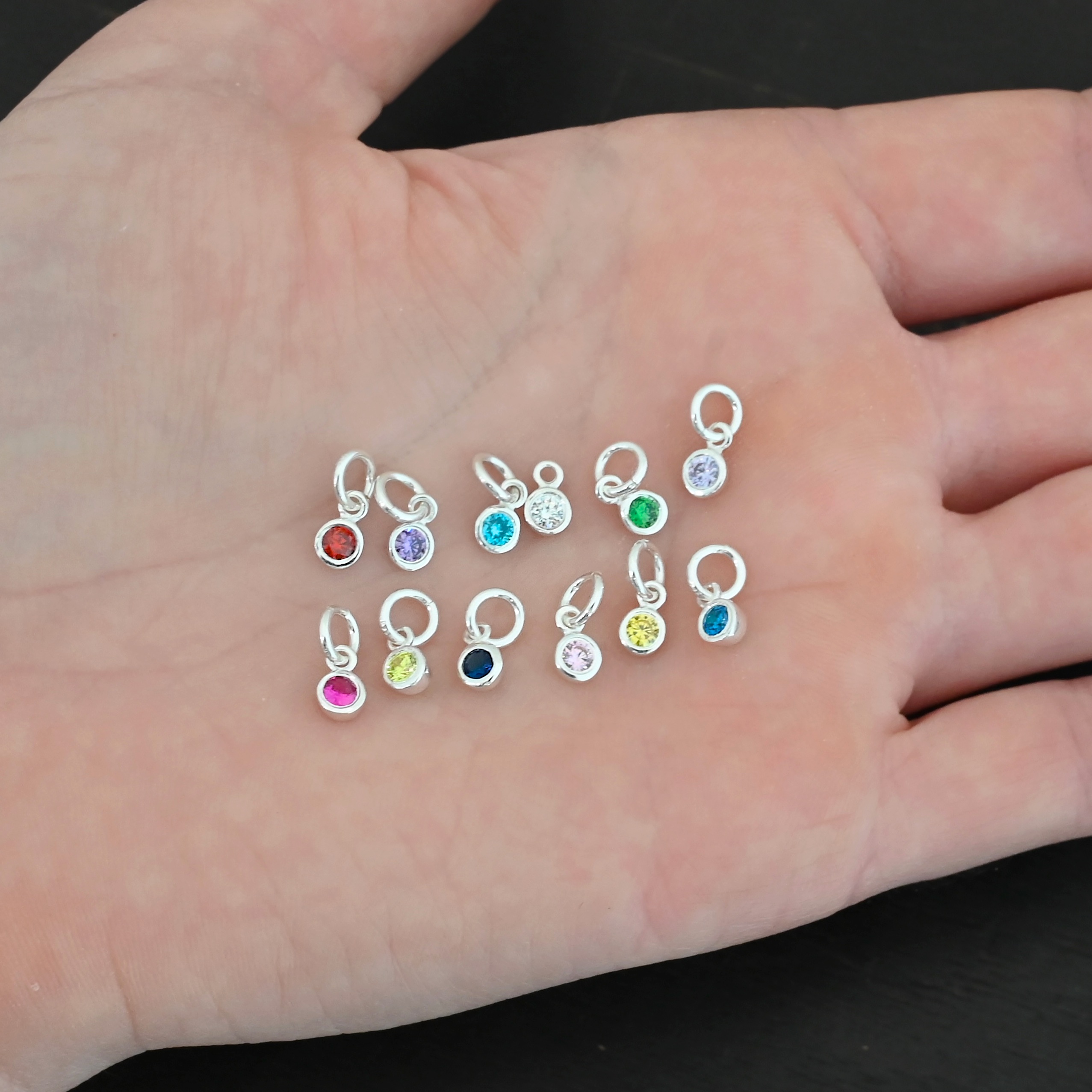4mm Birthstone Charm Silver shiny 4mm Birthstone Charms shown in hand