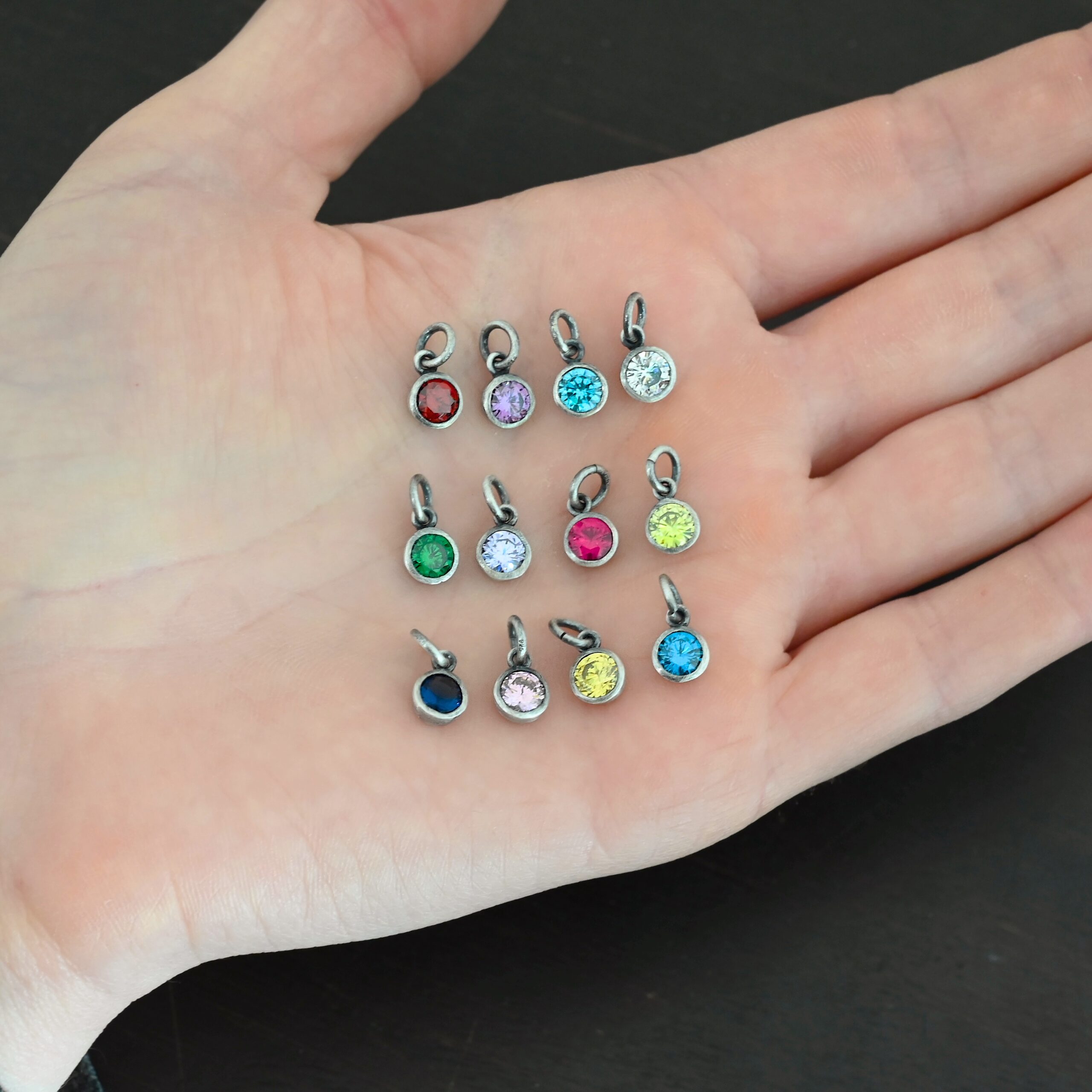 6mm Ox Birthstone Charm Silver oxidized 6mm Birthstone Charm shown in hand