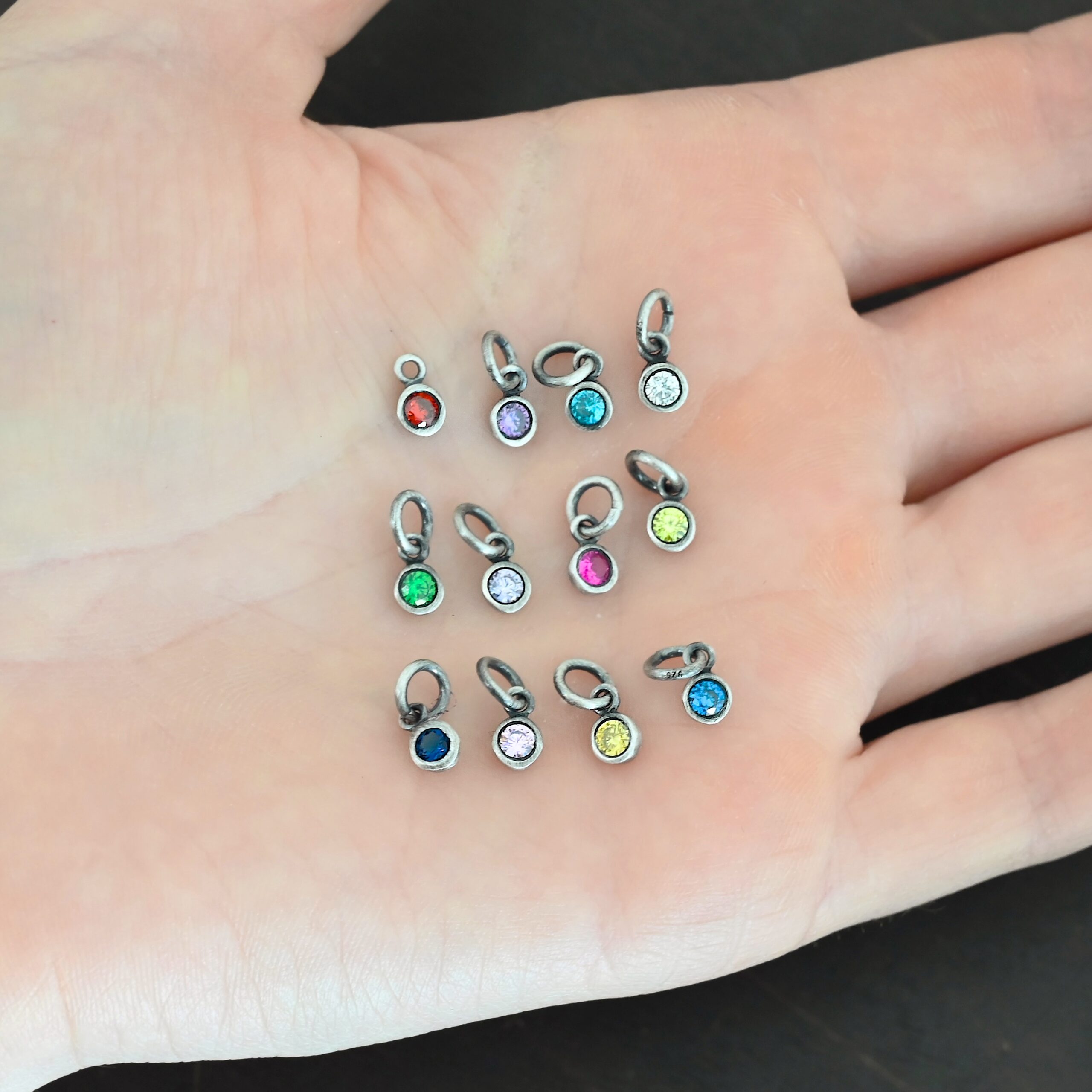 4mm Ox Birthstone Charm Silver oxidized 4mm Birthstone Charms shown in hand