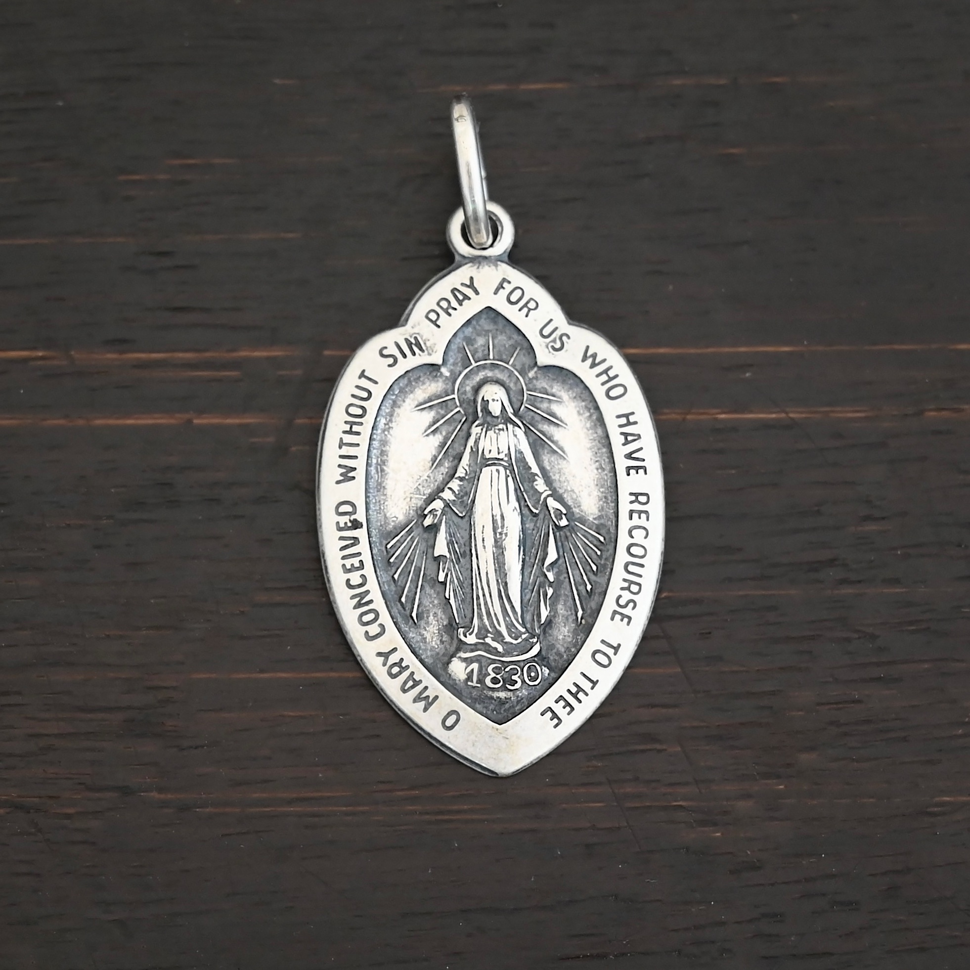 Silver Mary Medallion 26x15mm charm shown on dark background