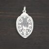 Silver back side of Mary Medallion 26x15mm charm shown on dark background