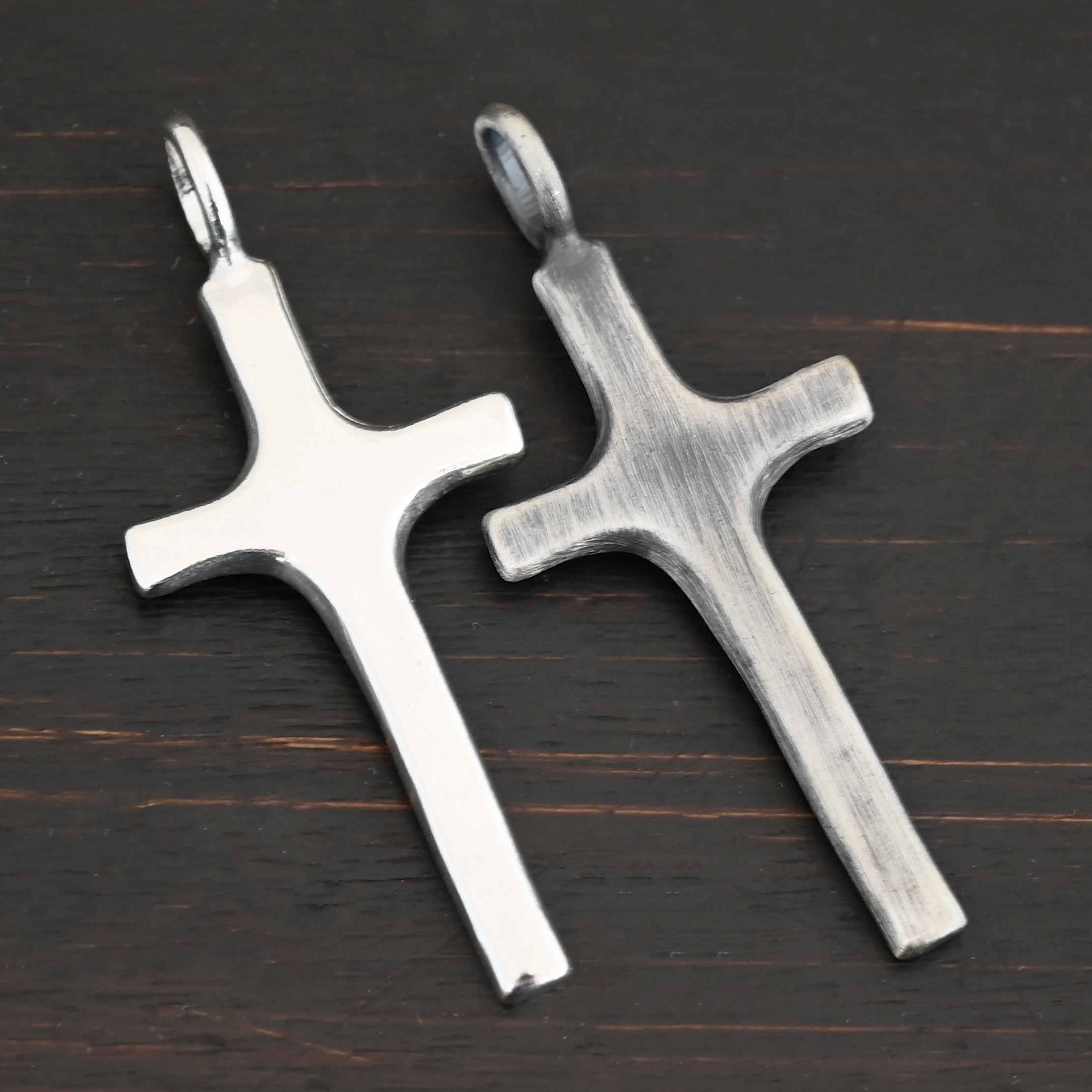 Silver large Cross pendant shiny & oxidized shown on dark background