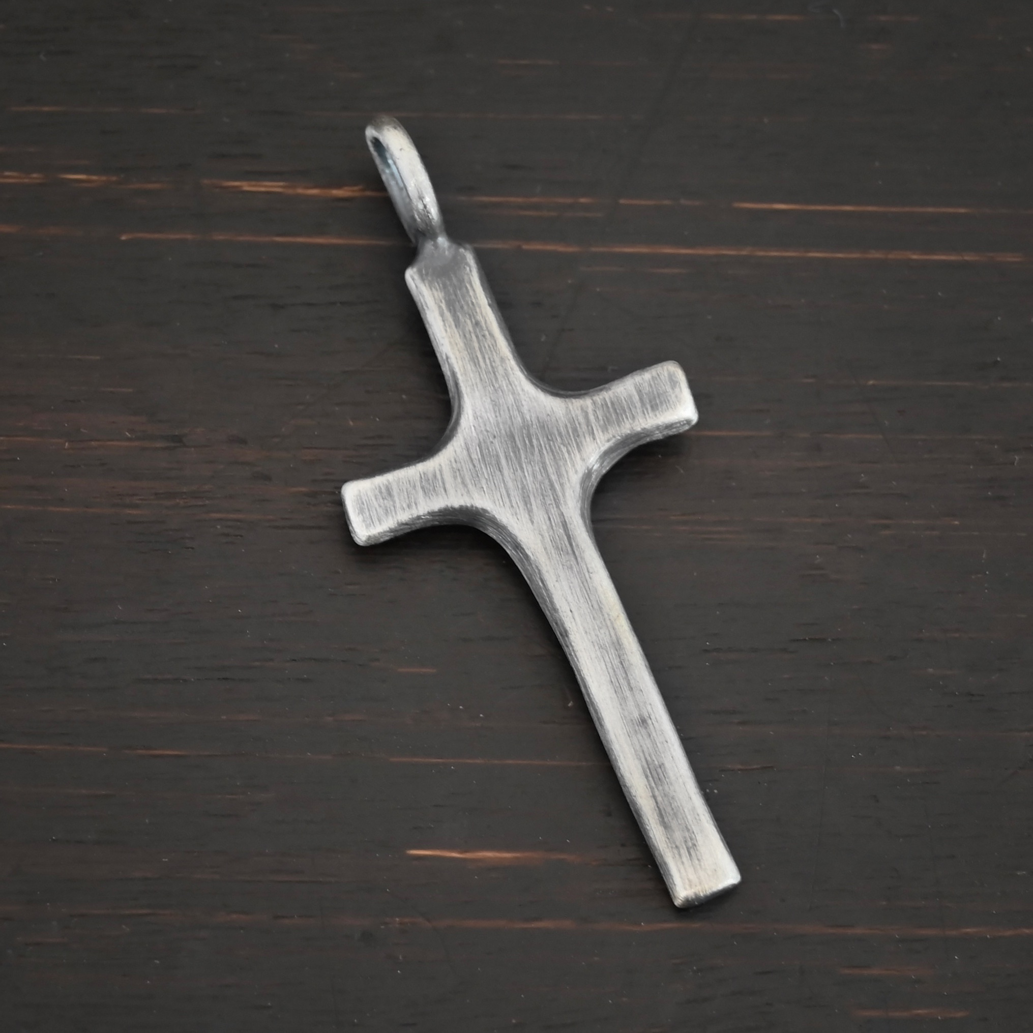 Silver large Cross pendant oxidized shown on dark background