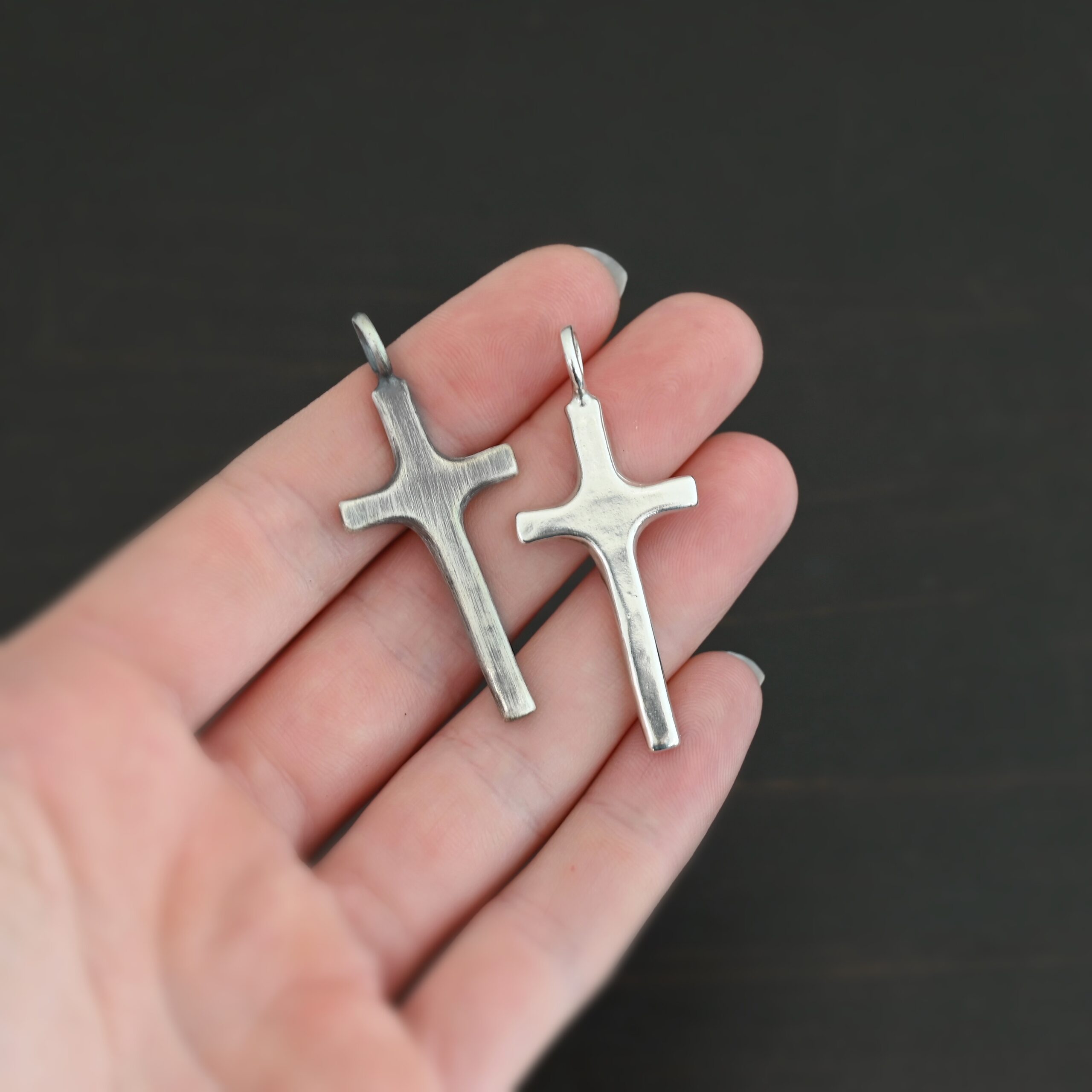 Silver large Cross pendant shiny & oxidized shown in hand
