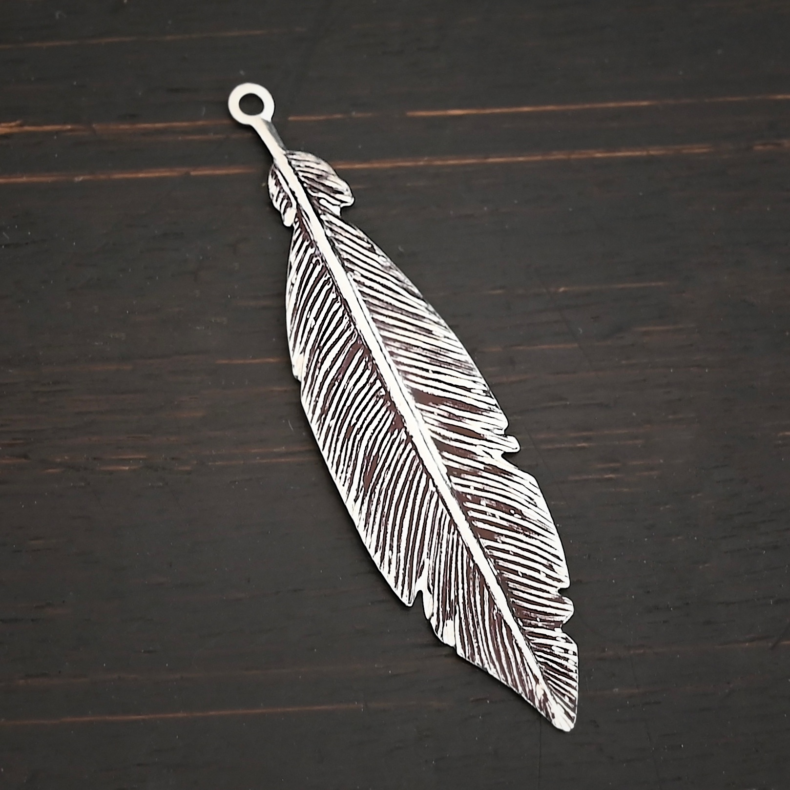 Feather Charm - ox Silver Feather charm oxidized charm shown on dark background