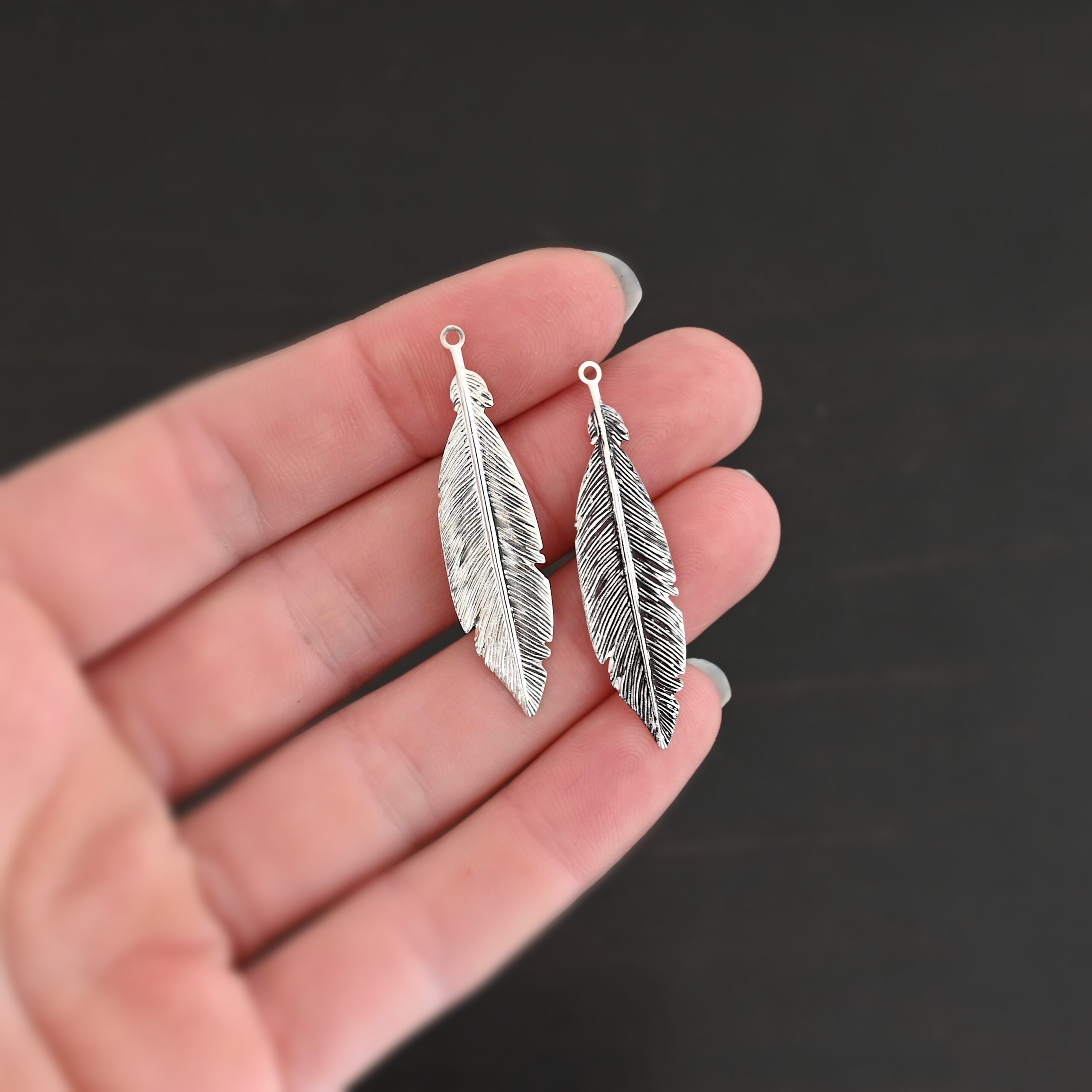 Feather Charm Silver Feather charm shiny & oxidized charm shown in hand