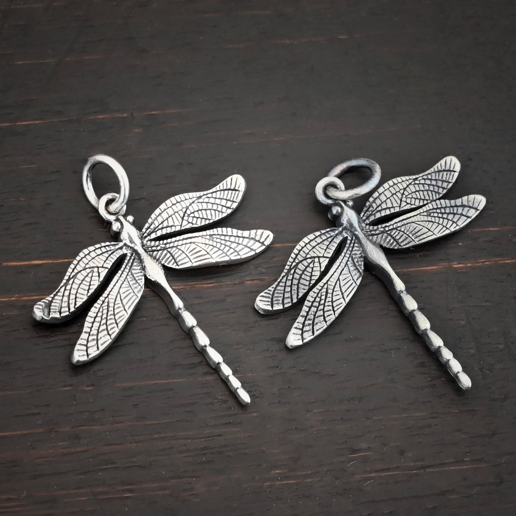 Silver Dragonfly charm shiny & oxidized charm shown on dark background