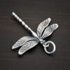 Silver Dragonfly charm oxidized charm shown on dark background