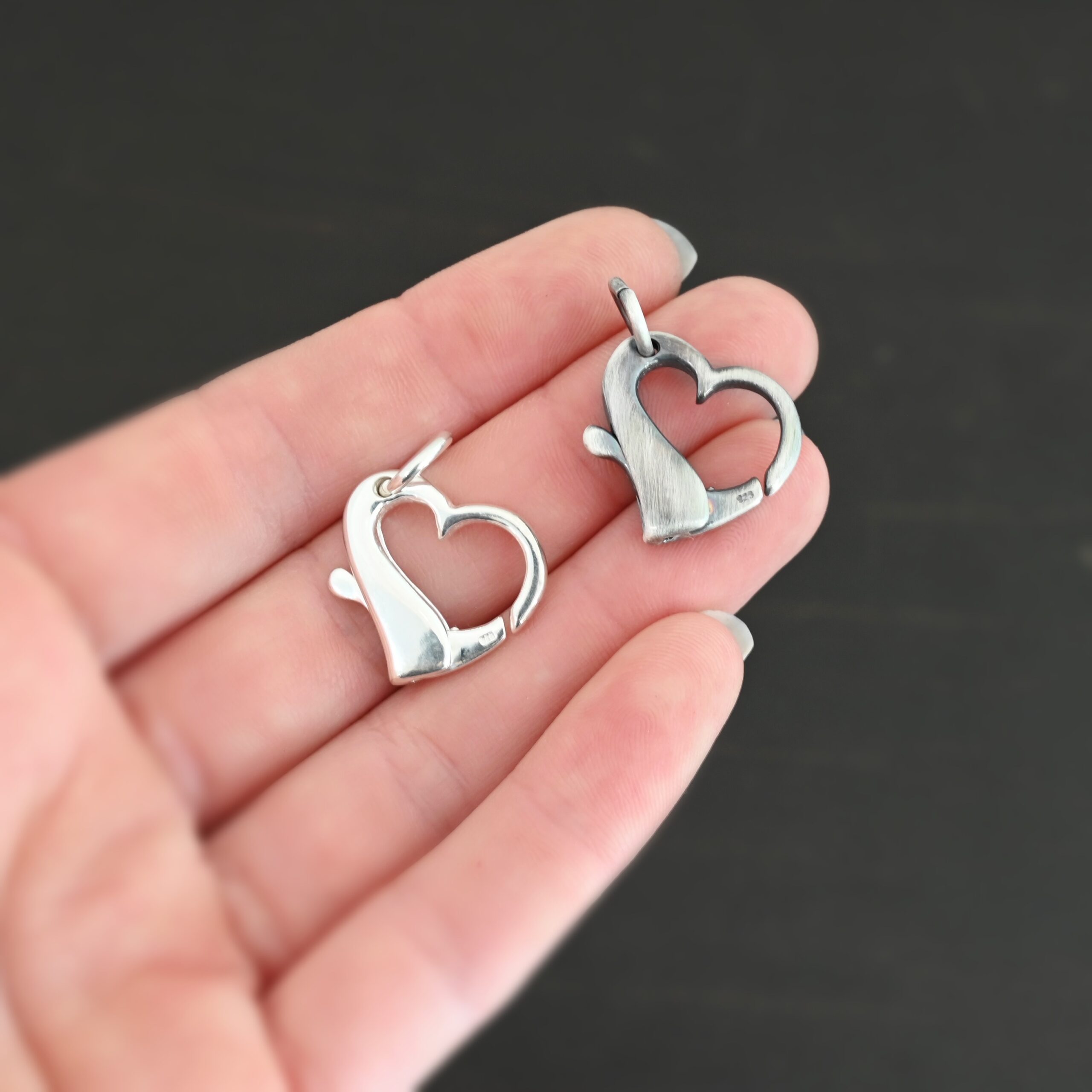 Silver Heart Ring Holder Pendant shiny & oxidized shown in hand