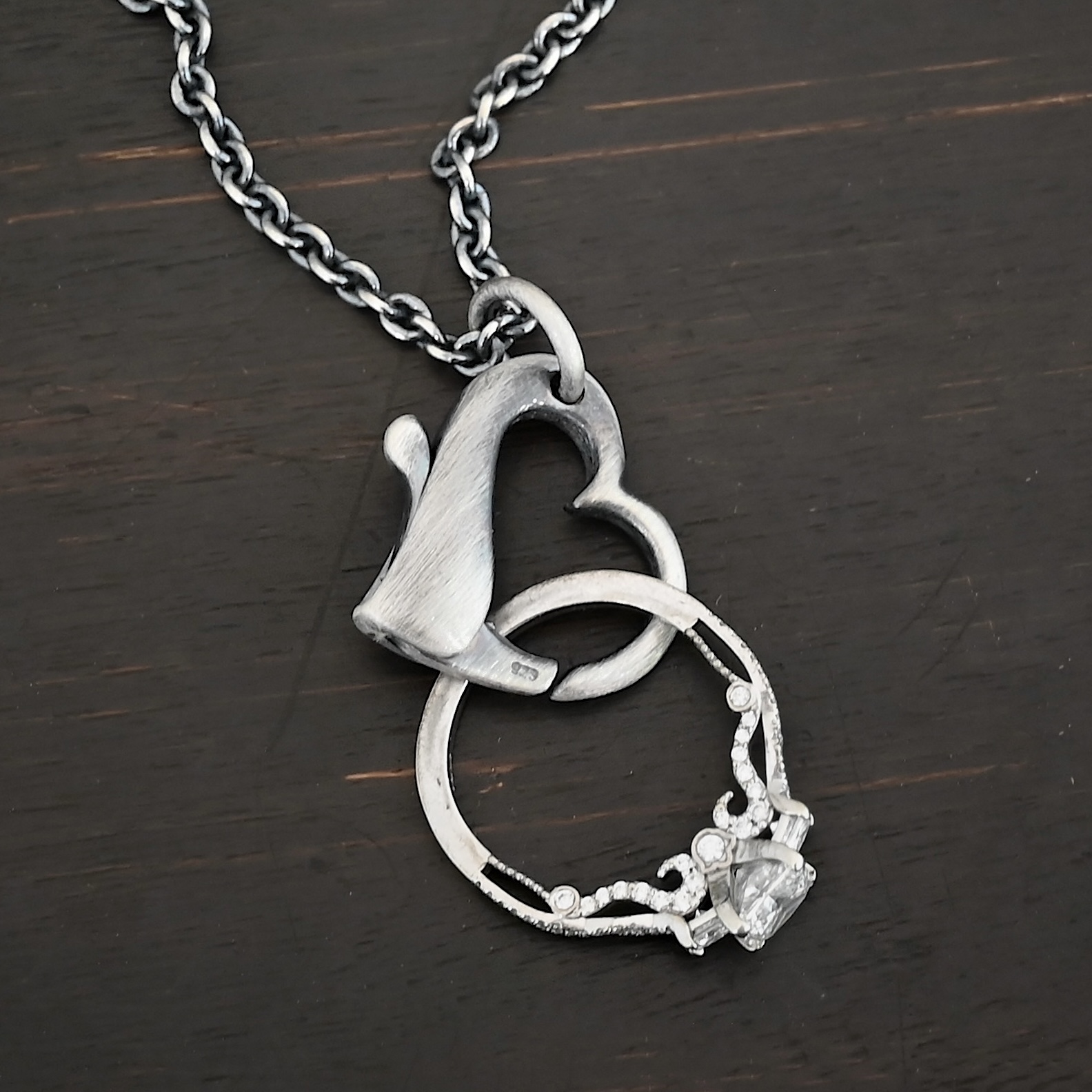 Silver Ring Holder Pendant oxidized shown on dark background