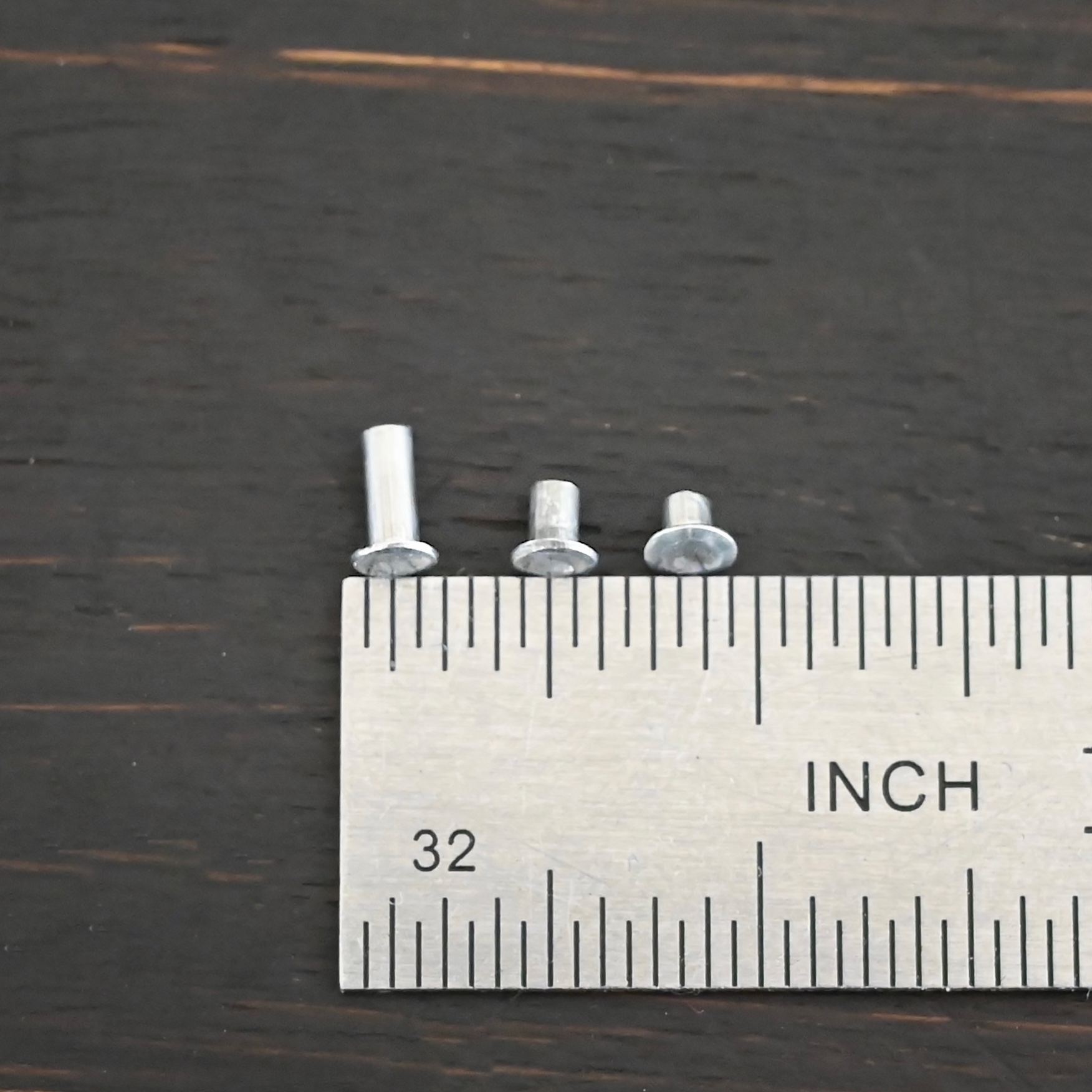 Aluminum Rivets 3 sizes shown by ruler