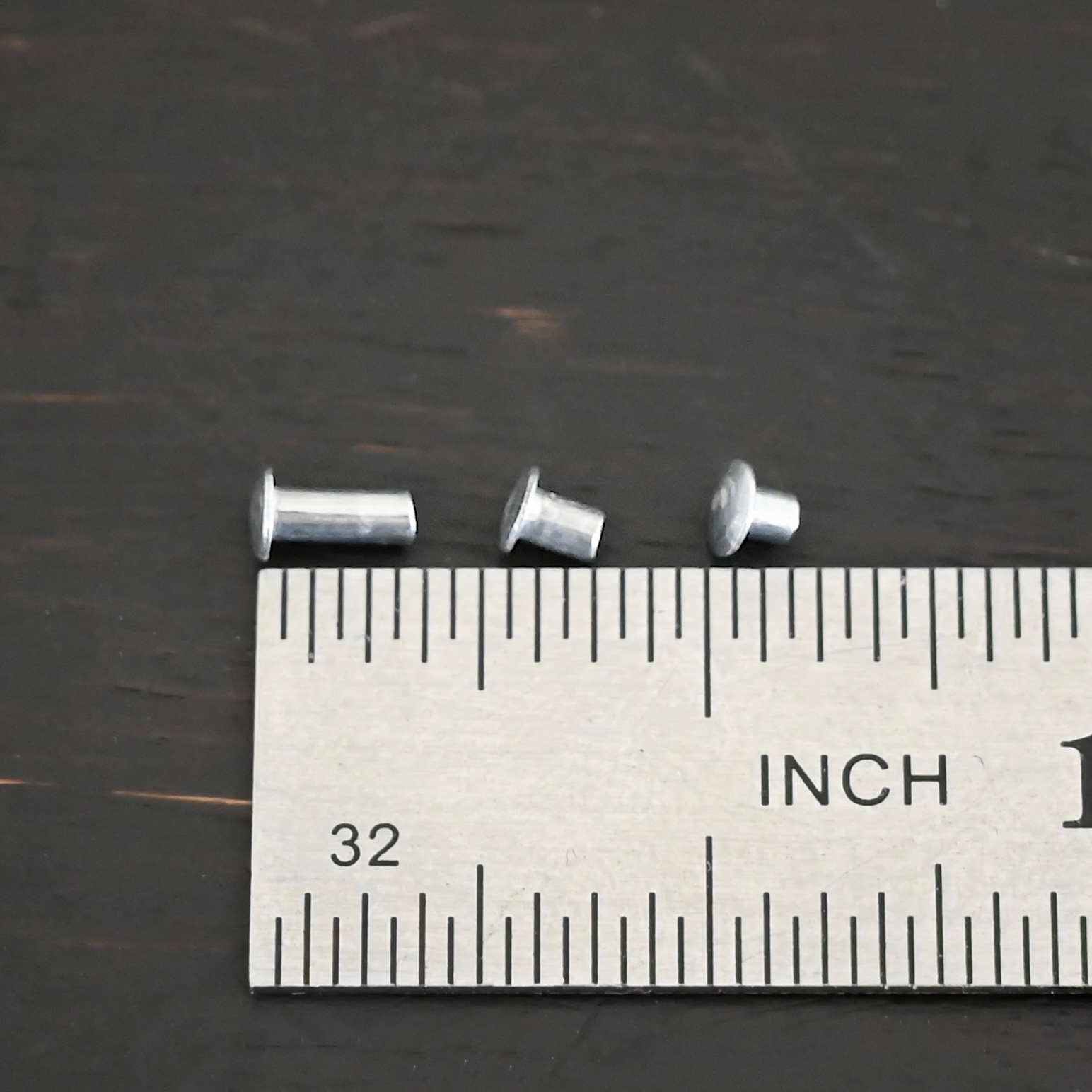 Aluminum Rivets 3 sizes shown by ruler