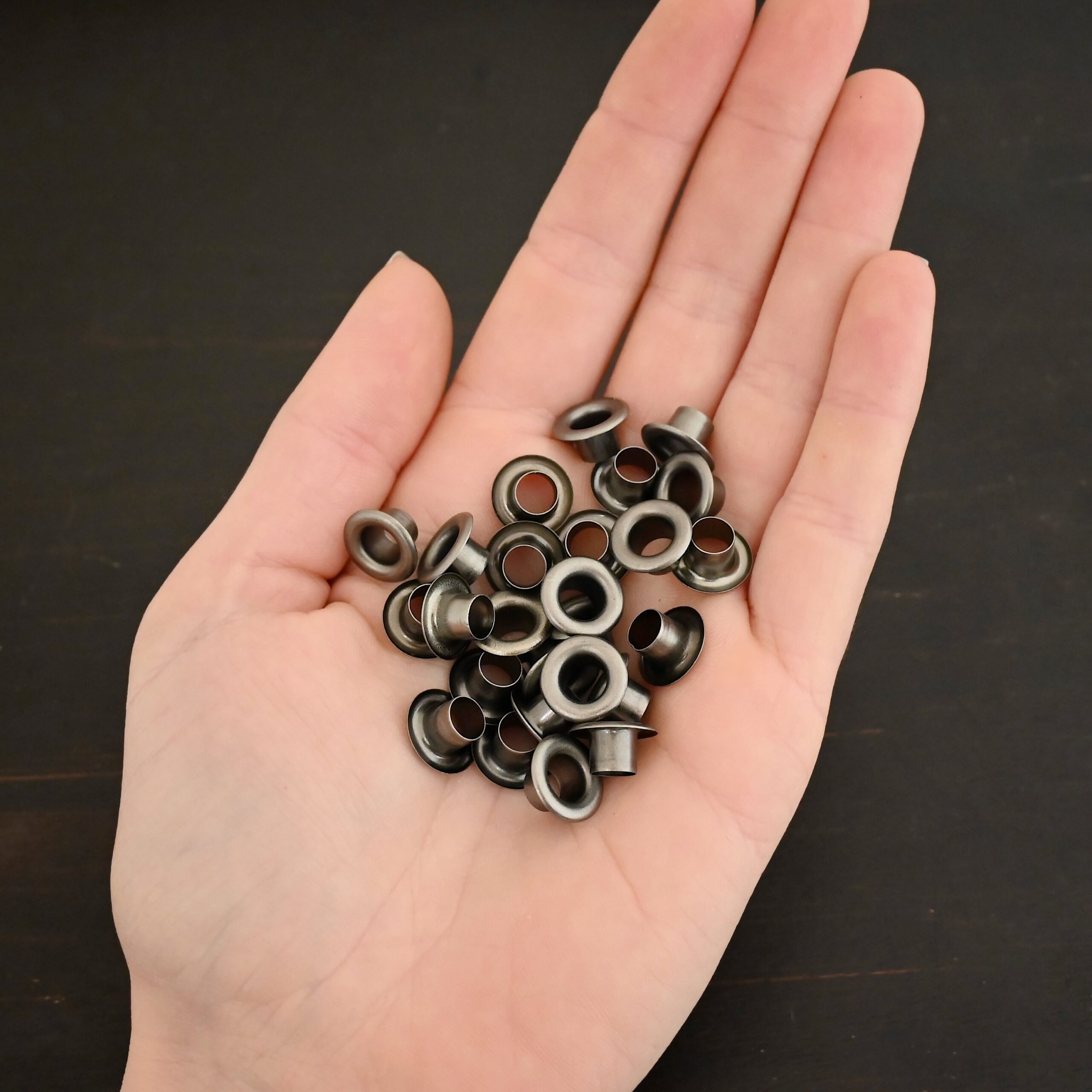 Large Bronze Grommets shown in hand