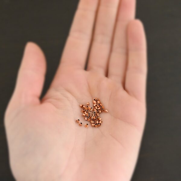 1/16x1/16 Copper Rivets shown in hand