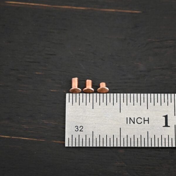 All Sizes Copper Rivets shown by ruler