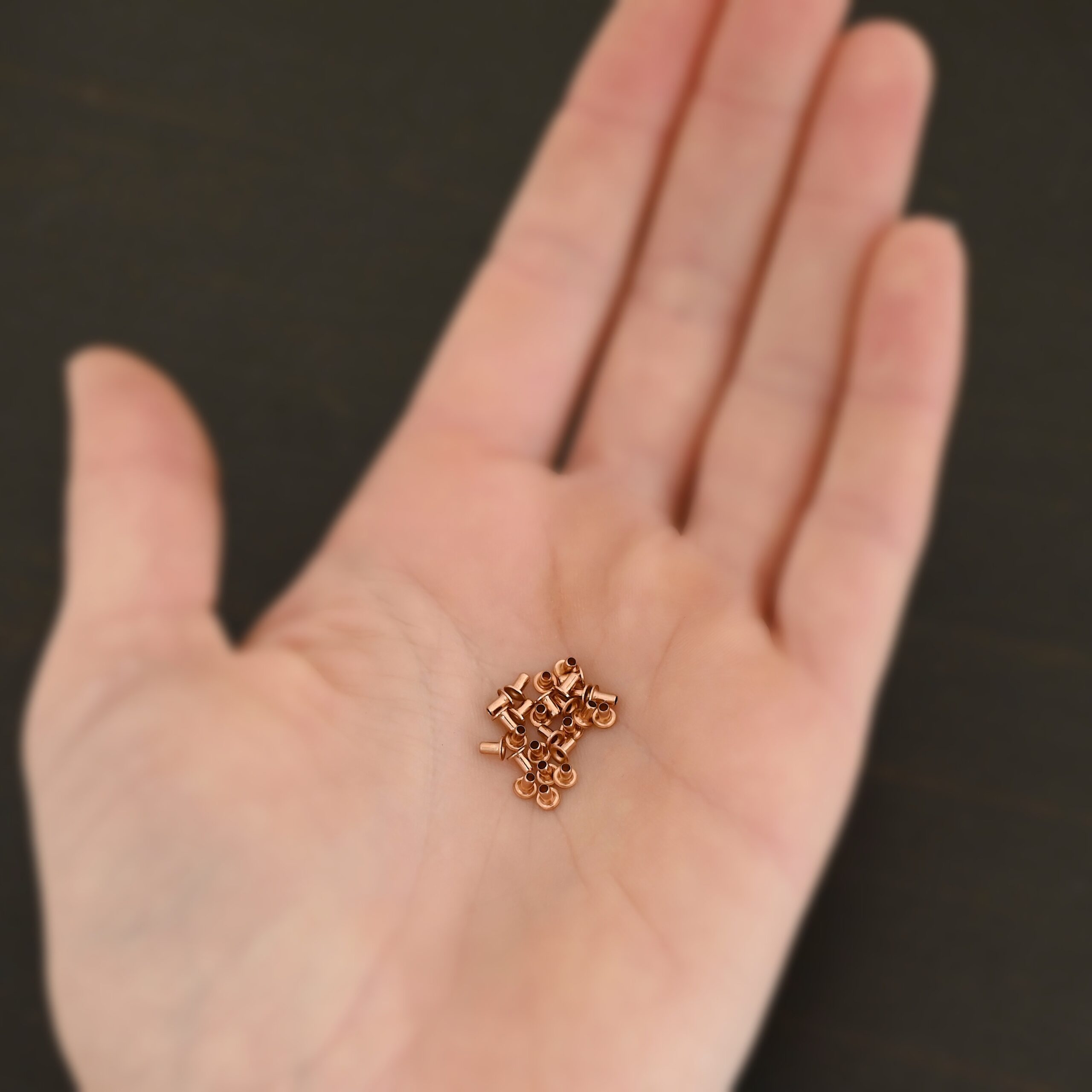 EZ Riveter 1/16x3/32 - Copper 1/16x3/32 copper eyelets for EZ Riveter shown in hand