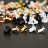 1/16x3/32 eyelets for EZ Riveter shown on dark background