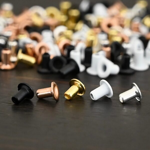1/16x3/32 eyelets for EZ Riveter shown on dark background