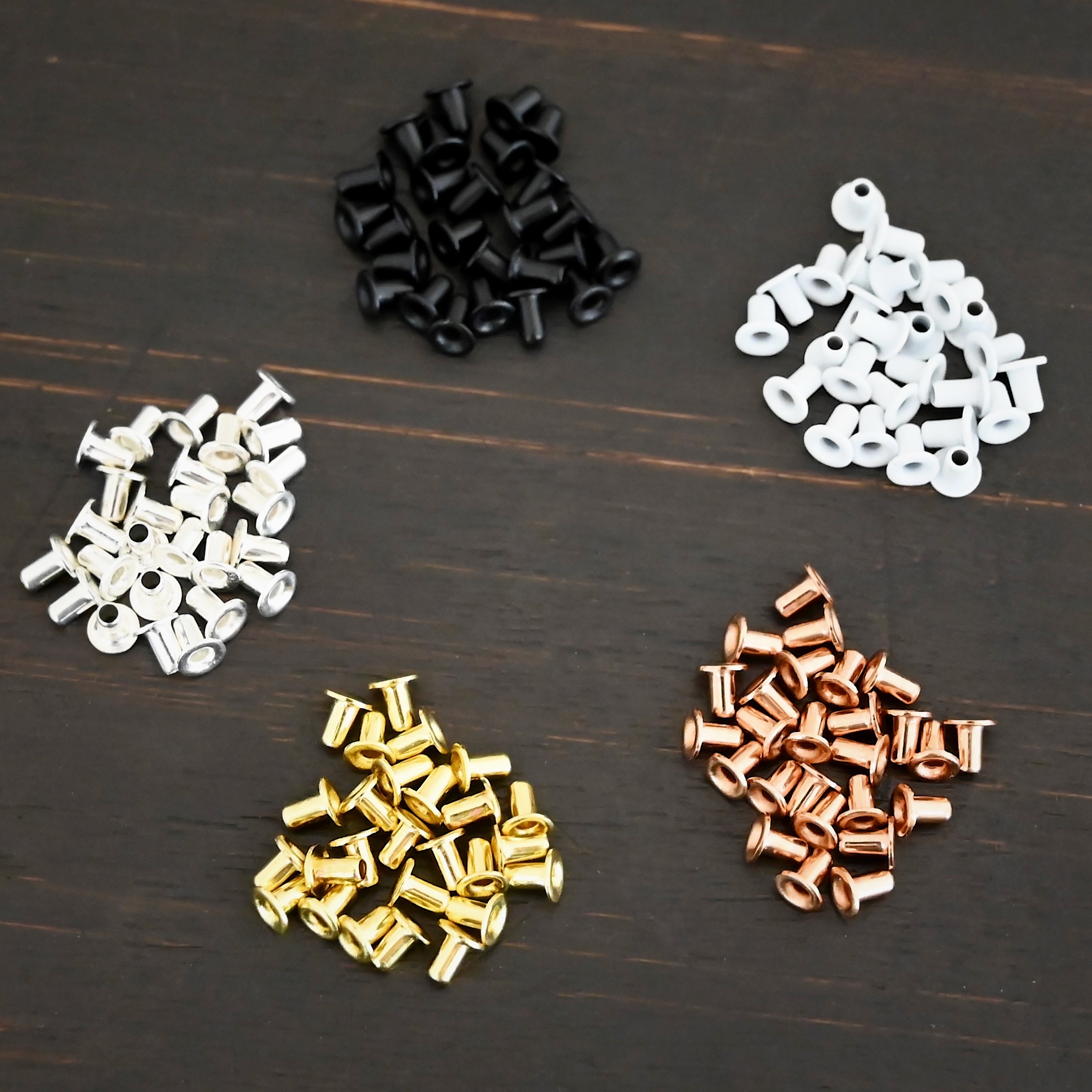 EZ Riveter 1/16x3/32 1/16x3/32 eyelets for EZ Riveter shown on dark background